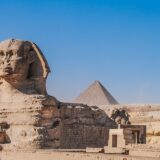 The Great Sphinx of Giza with the third pyramid